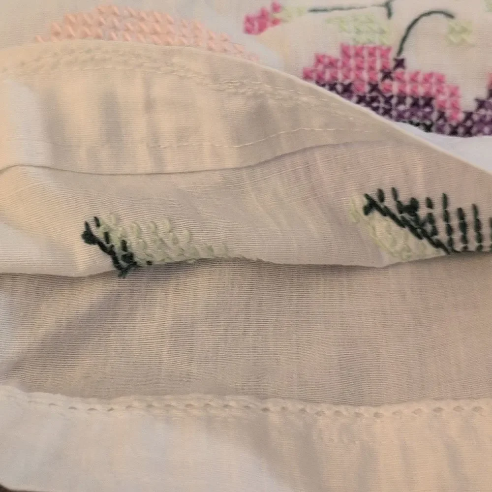 Vintage white pillowcase with embroidered purple‎ flowers